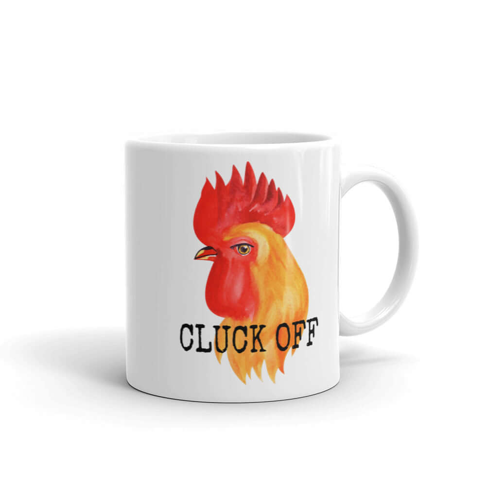 White ceramic mug pun that has graphic of a chicken and the words Cluck off printed on both sides.