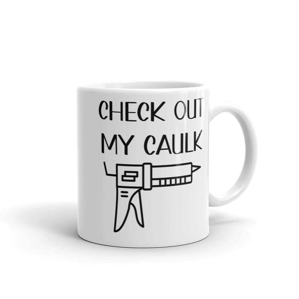 White ceramic coffee mug with the pun phrase Check out my caulk with a line drawing image of a caulking gun printed on both sides.