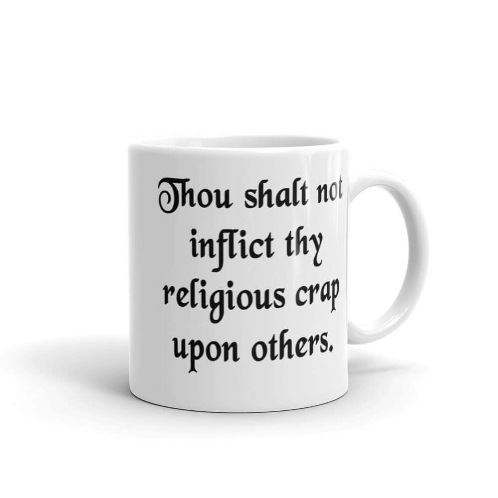 White ceramic coffee mug with the phrase Thou shalt not inflict thy religious crap upon others printed on both sides.