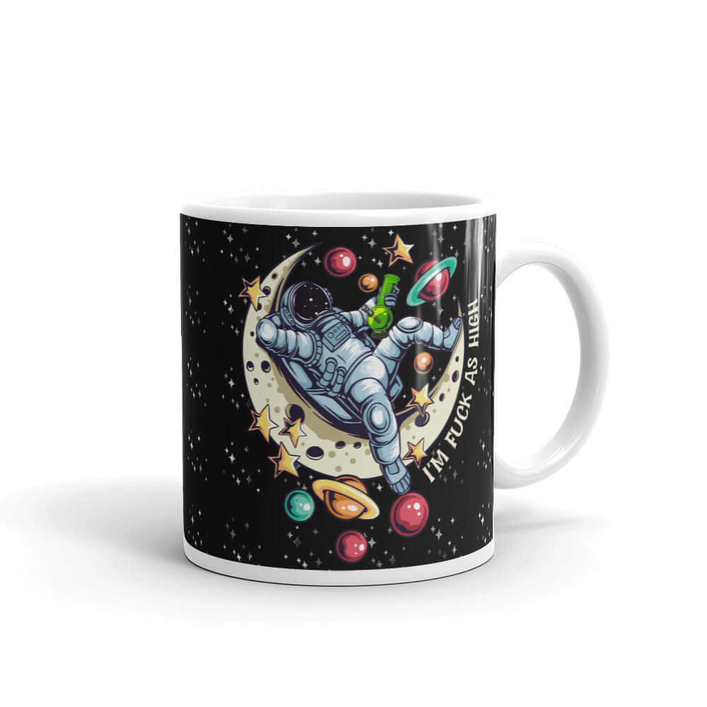 White ceramic mug with graphic of an astronaut sitting on the moon while smoking a bong with the words I'm fuck as high printed on both sides of the mug. The mug has a black speckled background.