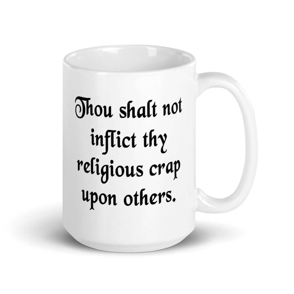 White ceramic coffee mug with the phrase Thou shalt not inflict thy religious crap upon others printed on both sides.