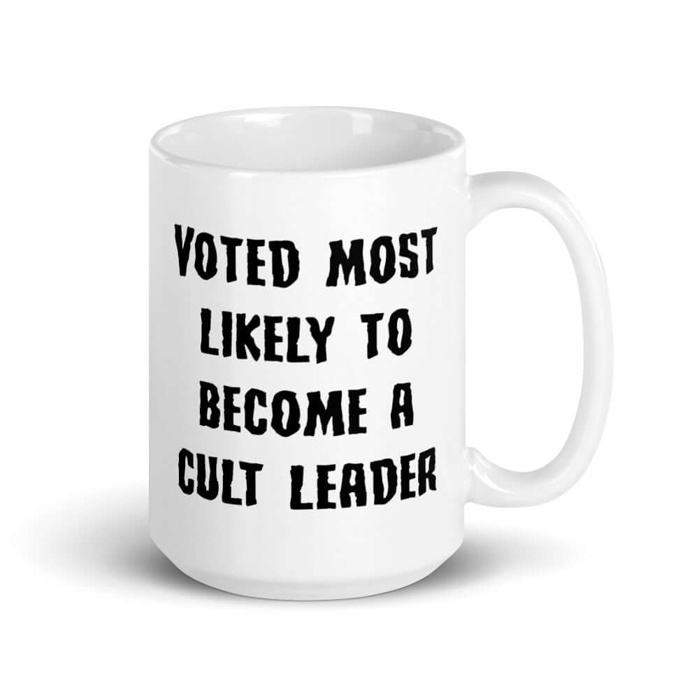 White ceramic mug with the words Voted most likely to become a cult leader printed on both sides. 