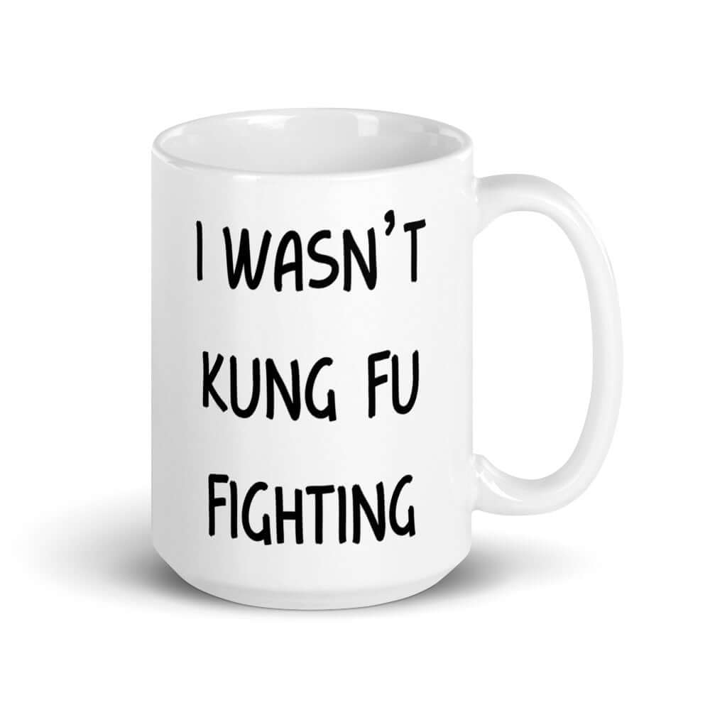 White ceramic coffee mug with the funny phrase I wasn't kung fu fighting printed on both sides.