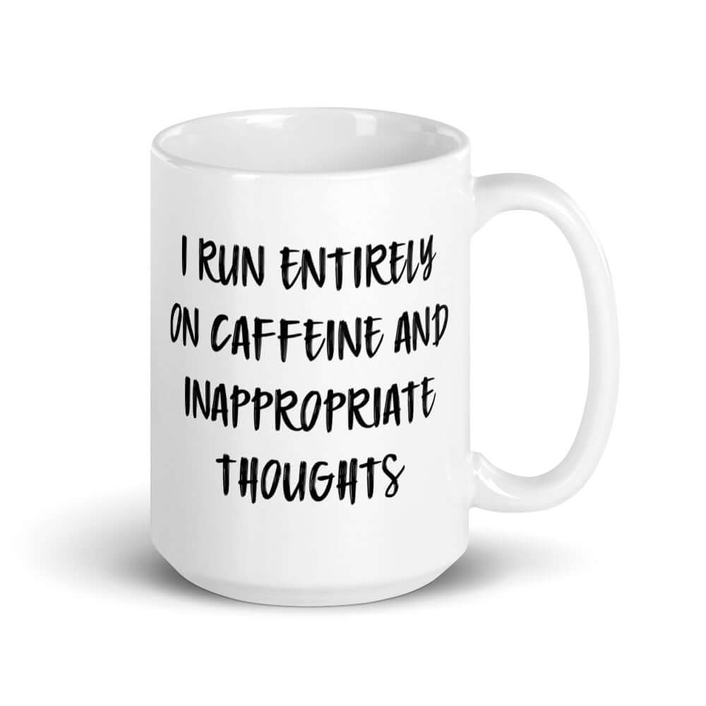 White ceramic coffee mug with the words I run entirely on caffeine & inappropriate thoughts printed on both sides.