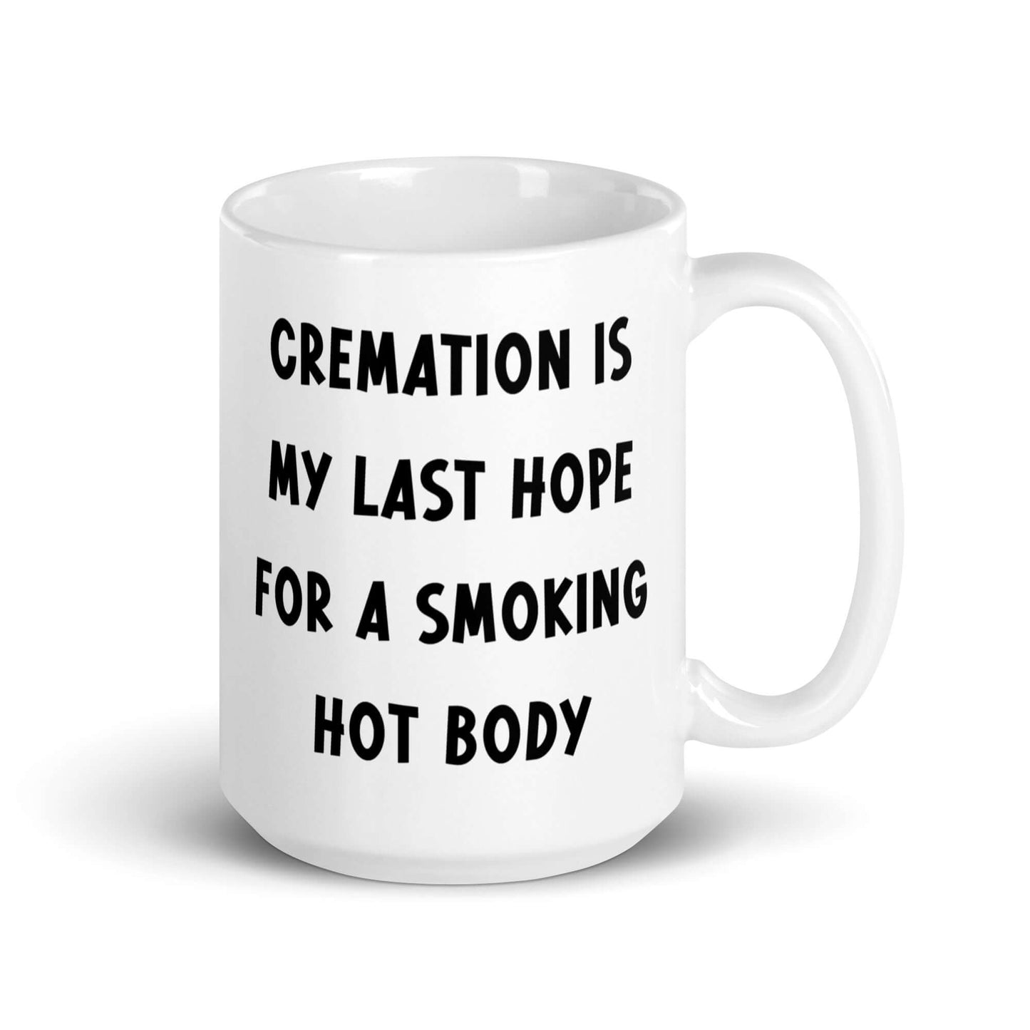 White ceramic mug with the words Cremation is my last hope for a smoking hot body printed on both sides.