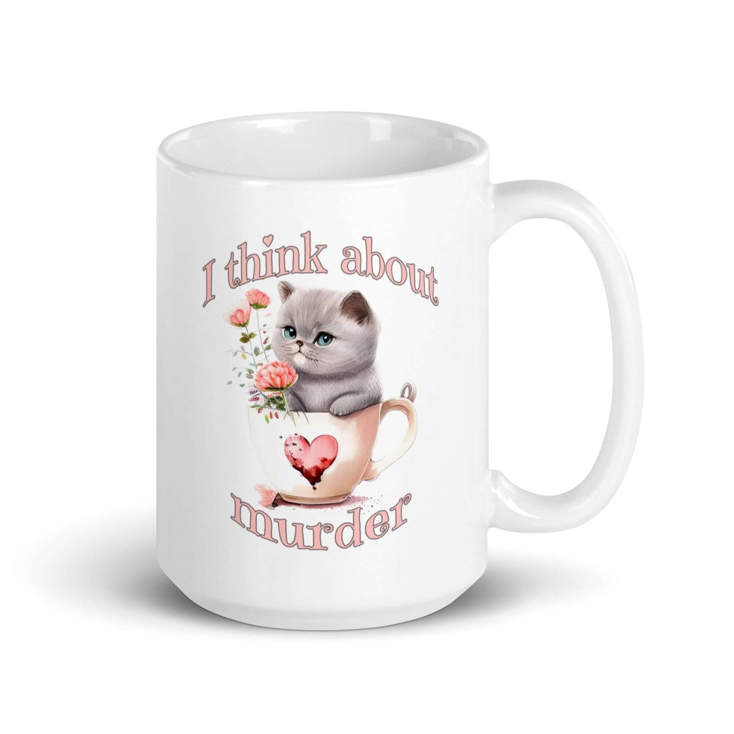 White ceramic mug that says I think about murder with image of cute fluffy kitten sitting in a teacup printed on both sides.