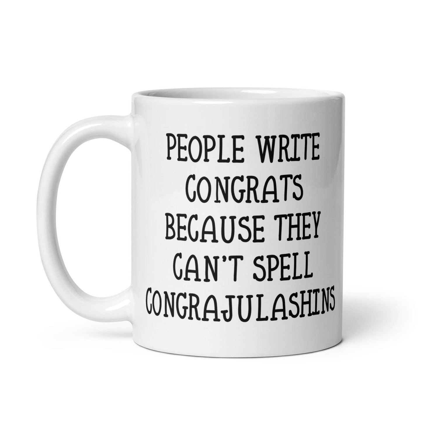 White ceramic mug with the words People write congrats because they can't spell congratulations printed on both sides. The word congratulations is intentionally misspelled.