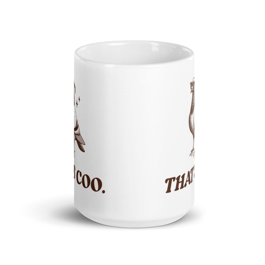 White ceramic mug with an image of a pigeon and the words 'That's coo.' printed on both sides.