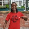 Woman wearing a red t-shirt with the text 'No one wants to hear your music' printed on the front.