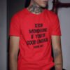 Man wearing a red t-shirt with the phrase 'Stop wondering if you're good enough. You're not.' printed on the front. The words 'You're not' are smaller then the rest.