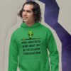 Man wearing a green hoodie sweatshirt with image of an alien and the words 'Being abducted by aliens might just be the vacation I need right now' printed on the front.