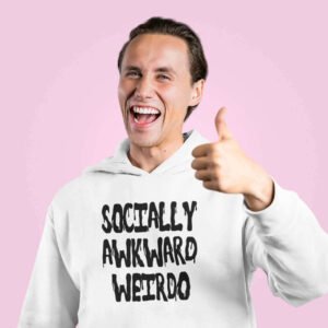 Smiling man giving a thumbs up while wearing a white hoodie sweatshirt with the text 'Socially awkward weirdo' printed on the front.