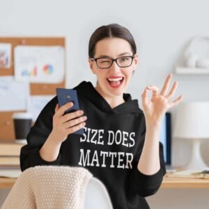 Winking woman wearing a black hoodie sweatshirt with the text 'Size does matter' printed on the front.