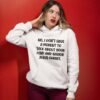 Annoyed looking woman wearing a white hoodie sweatshirt with the phrase 'No, I don't have a moment to talk about your lord and savior Jesus Christ.' printed on the front.