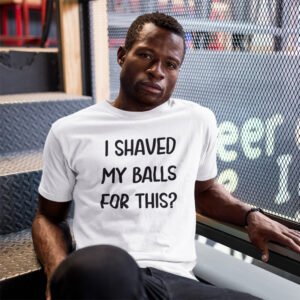 Man wearing a white t-shirt hoodie sweatshirt with the text "I shaved my balls for this?' printed on the front.