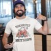 Man wearing a white t-shirt with a circus theme graphic and the text 'Ringmaster of the Shitshow' printed on the front.