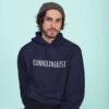 Man wearing a navy blue hoodie sweatshirt with the word 'Cunnilinguist' printed on the front.