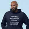 Grinning man wearing navy blue hooded sweatshirt with the text 'Everything happens for a reason. Sometimes the reason is you're stupid and make bad decisions' printed on the front.