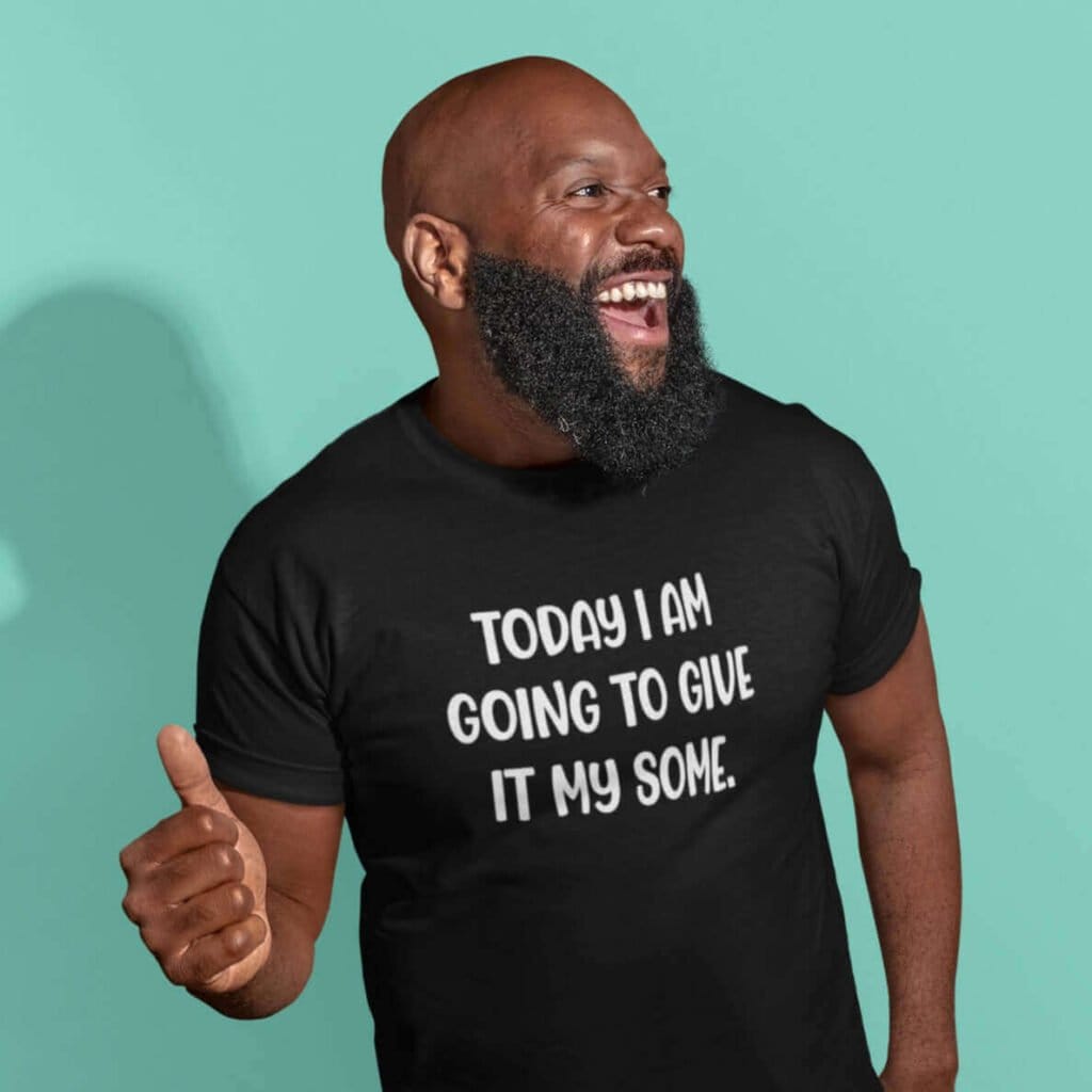 Smiling man wearing a black t-shirt with the text 'Today I am going to give it my some.' printed on the front.