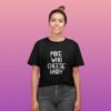 Smiling woman wearing black pun t-shirt with the text 'Mike who cheese hairy' printed on the front.