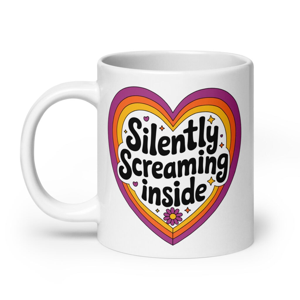White ceramic coffee mug with a colorful graphic that says 'Silently screaming inside'. The graphics are printed on both sides of the mug.