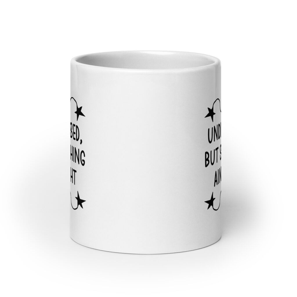 White ceramic mug with the text 'Undiagnosed, but something ain't right' printed on both sides.