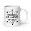 White ceramic mug with the text 'Undiagnosed, but something ain't right' printed on both sides.