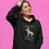 Woman wearing black hoodie sweatshirt with an image of a colorful donkey pinata with the words 'Worst part is I kind of like getting beat' printed on the front.