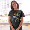 Older woman wearing black t-shirt with the text 'Free Mom hugs' in rainbow lettering printed on the front.