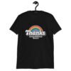 Black t-shirt with an image of a rainbow and the words 'Thanks for the childhood trauma' printed on the front. The word Thanks is large and the rest of the words are smaller under.