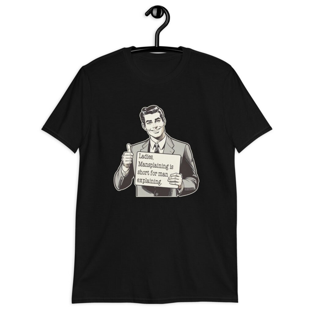 Black t-shirt with graphic of a retro man holding sign that says 'Ladies, mansplaining is short for man explaining' printed on the front.
