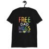 Black t-shirt with the text 'Free Dad hugs' printed on the front in rainbow letters.