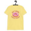 Cornsilk yellow t-shirt that has an image of a donut with pink icing and sprinkles and the text 'Eat more hole foods' printed on the front.