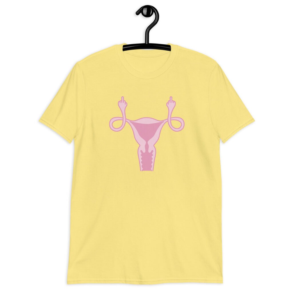 Cornsilk yellow t-shirt with image of a pink uterus flipping middle finger graphic printed on the front.