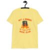 Cornsilk yellow t-shirt with image of a burning bible and the text 'Not a member of your little book club' printed on the front.
