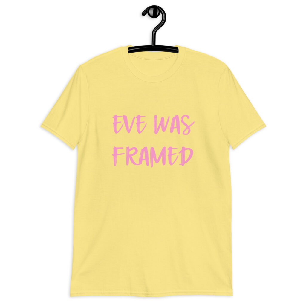 Cornsilk yellow t-shirt with the text 'Eve was framed' printed on the front in pink.