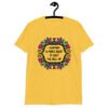 Daisy yellow t-shirt with a colorful doodle graphic and the words 'I support a man's right to shut the hell up.' The design is printed on the front.