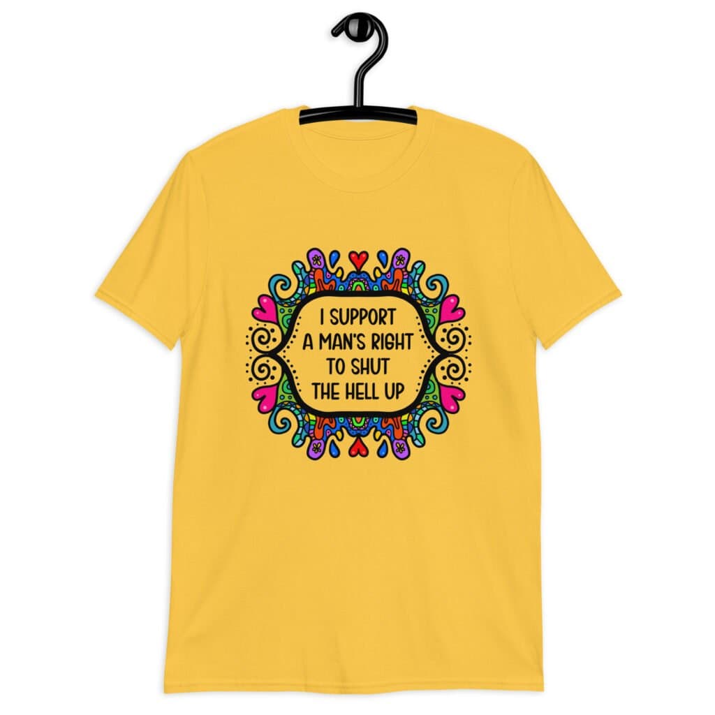 Daisy yellow t-shirt with a colorful doodle graphic and the words 'I support a man's right to shut the hell up.' The design is printed on the front.