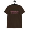 Dark chocolate brown t-shirt with the text 'The boobs are real, the smile is fake.' printed in pink on the front.