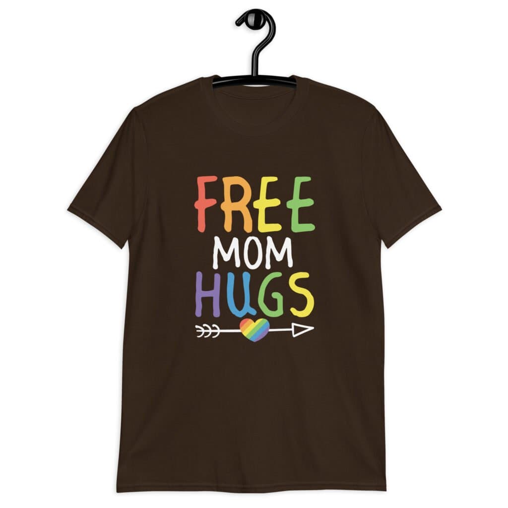 Dark chocolate brown t-shirt with the text 'Free Mom hugs' in rainbow lettering printed on the front.