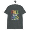 Dark heather grey t-shirt with the text 'Free Dad hugs' printed on the front in rainbow letters.