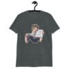 Dark heather grey t-shirt that has a graphic of an angry looking retro woman holding a knife and a sign. The sign says 'Tell me to calm down. I dare you.' The graphic is printed on the front of the shirt.