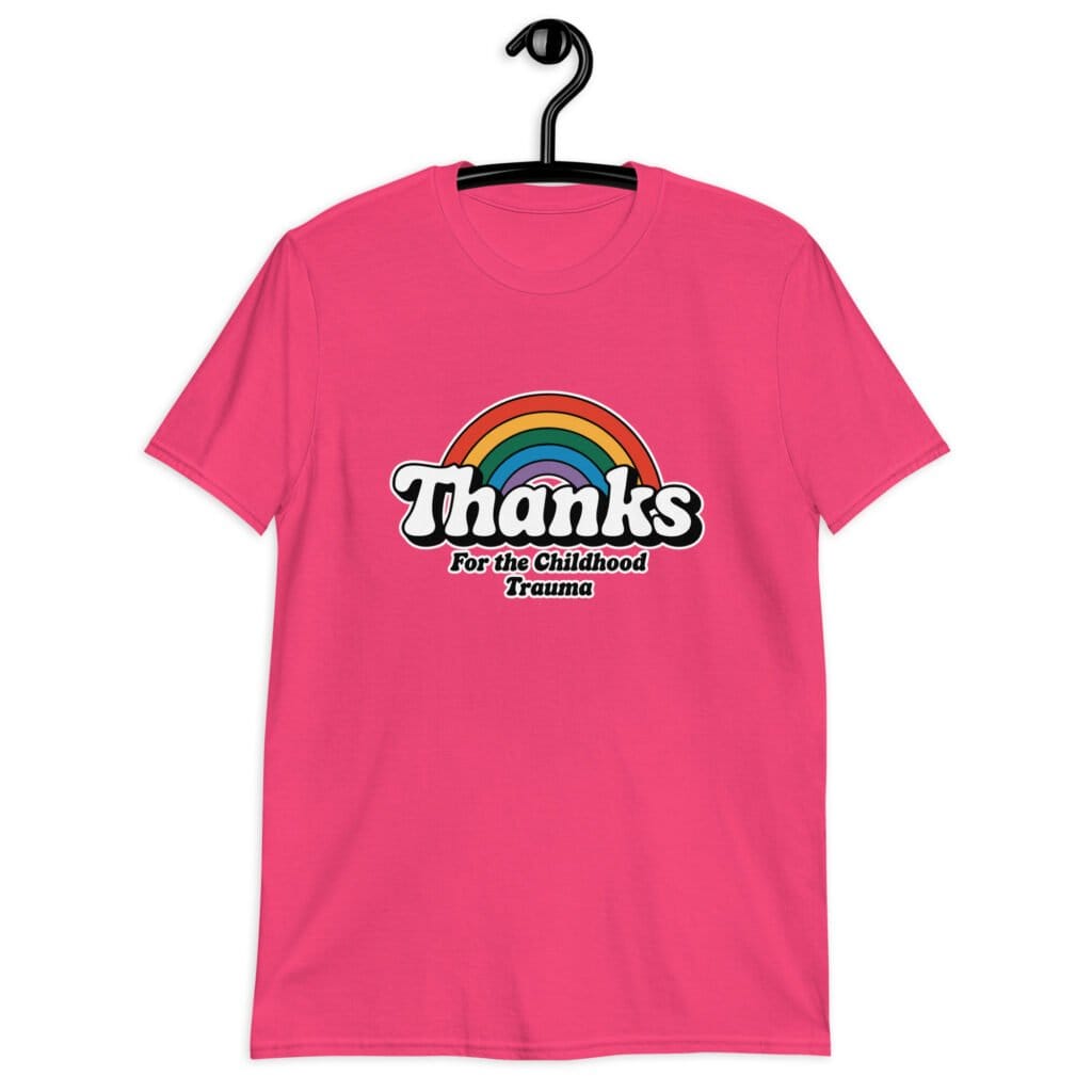 Heliconia pink t-shirt with an image of a rainbow and the words 'Thanks for the childhood trauma' printed on the front. The word Thanks is large and the rest of the words are smaller under.