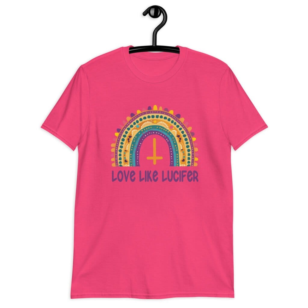 Heliconia pink t-shirt with an image of a boho style rainbow. There is an upside down cross in the center arch of the rainbow and the text 'Love like Lucifer' printed under. The graphics are printed on the front.