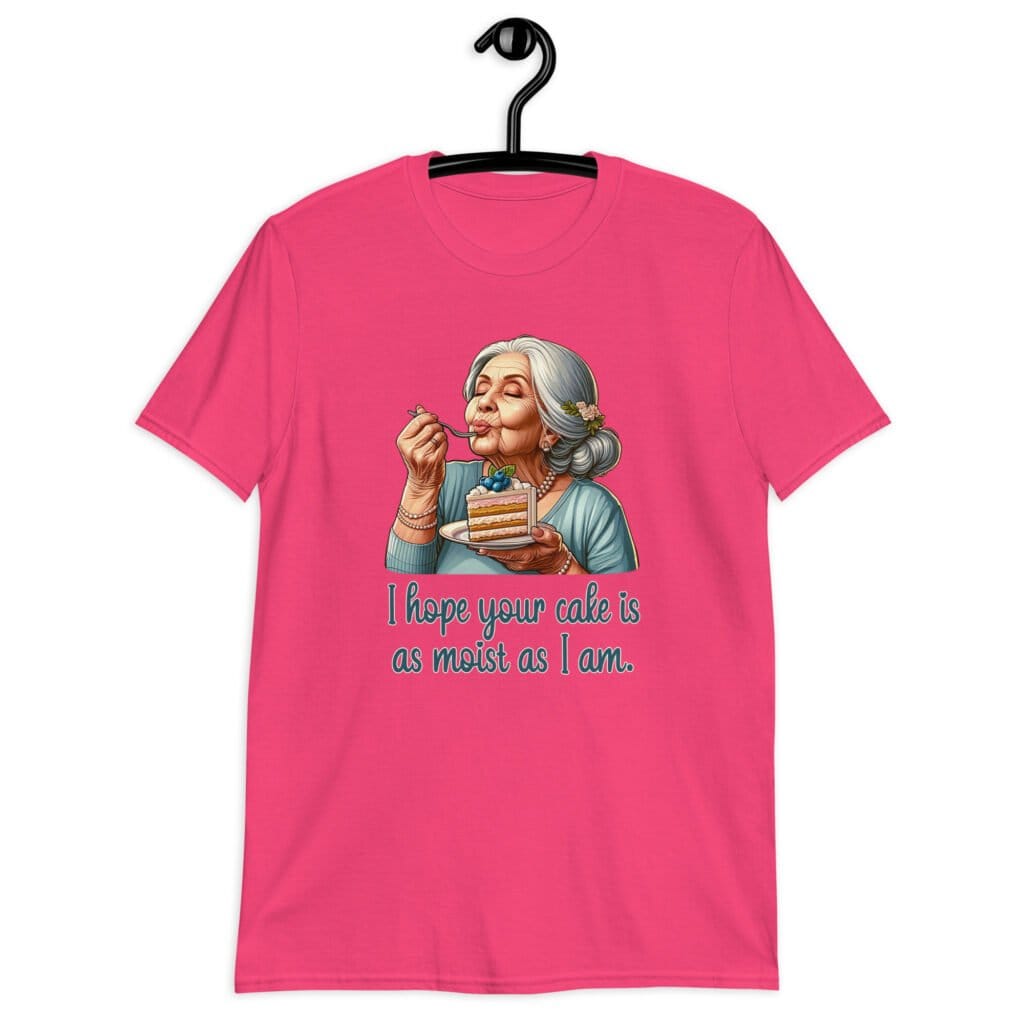 Heliconia pink t-shirt with an image of grey haired older woman enjoying a bite of a piece of cake with the words 'I hope your cake is as moist as I am' printed on the front.