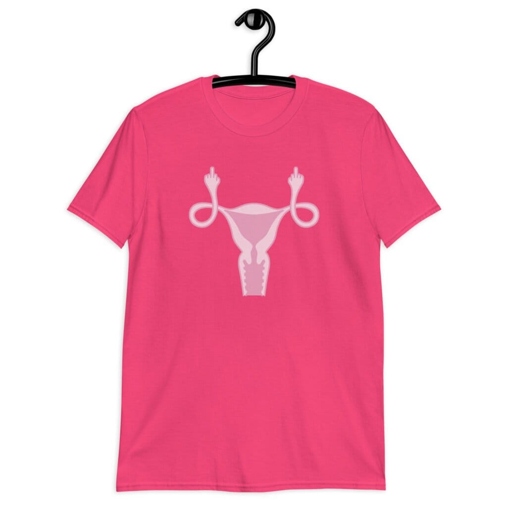 Heliconia pink t-shirt with image of a pink uterus flipping middle finger graphic printed on the front.