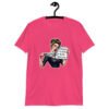 Heliconia pink t-shirt that has a graphic of an angry looking retro woman holding a knife and a sign. The sign says 'Tell me to calm down. I dare you.' The graphic is printed on the front of the shirt.