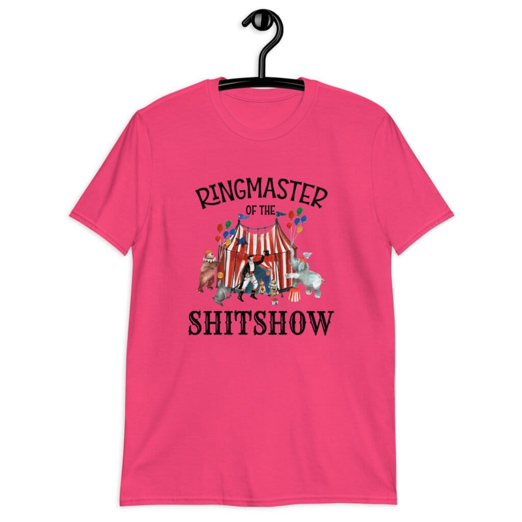 Heliconia pink t-shirt with a circus theme graphic and the text 'Ringmaster of the Shitshow' printed on the front.