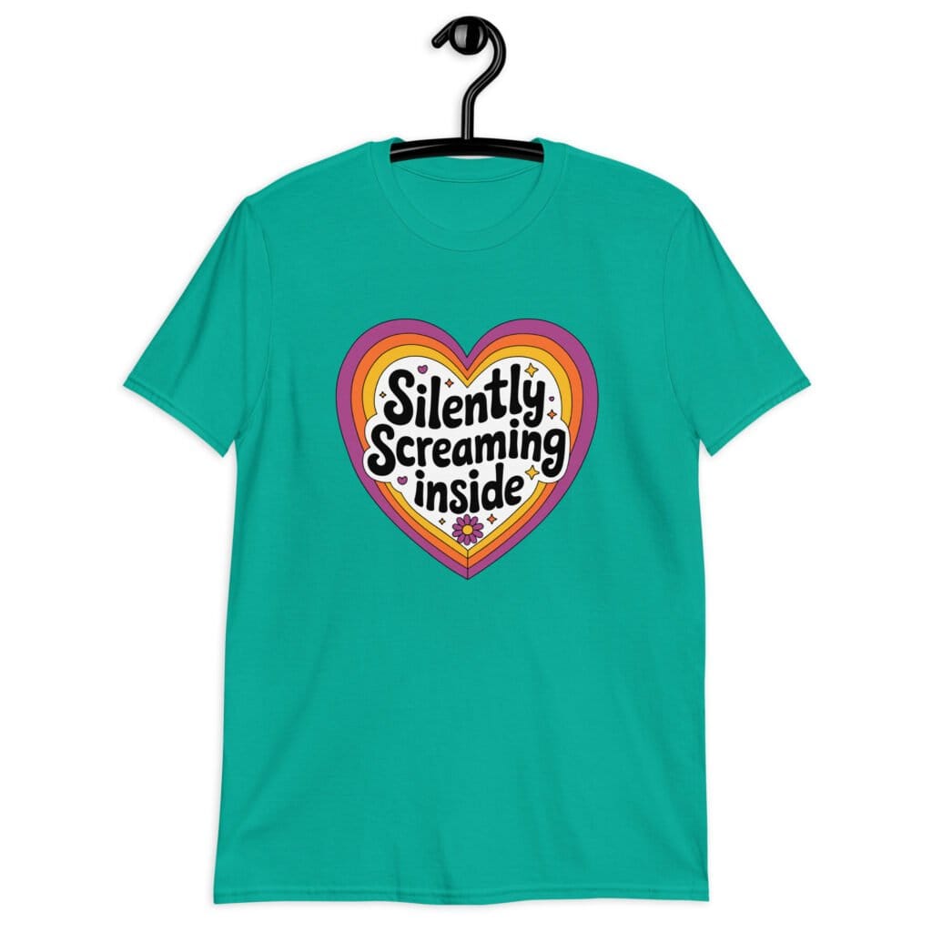 Jade color t-shirt with a colorful graphic that says 'Silently screaming inside'. The graphics are printed on the front.