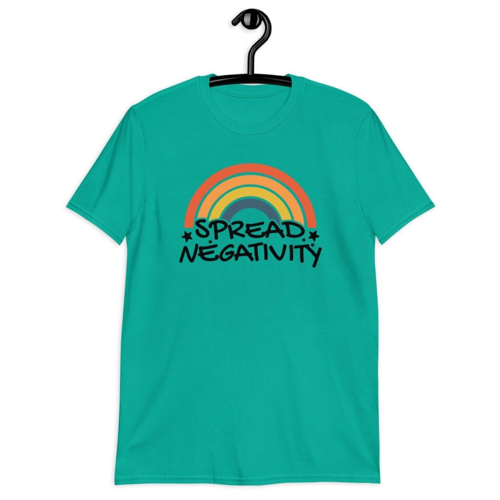 Jade color t-shirt with a graphic of a rainbow and the words 'Spread negativity' printed on the front.